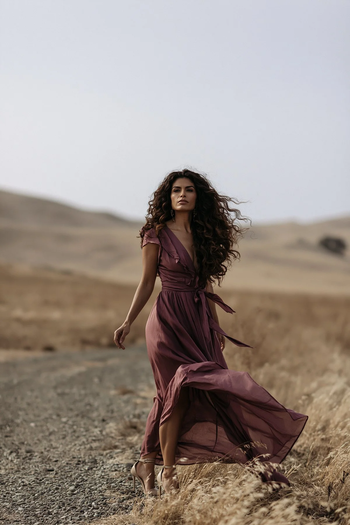 Realistic AI fashion character walking through a cinematic desert landscape.