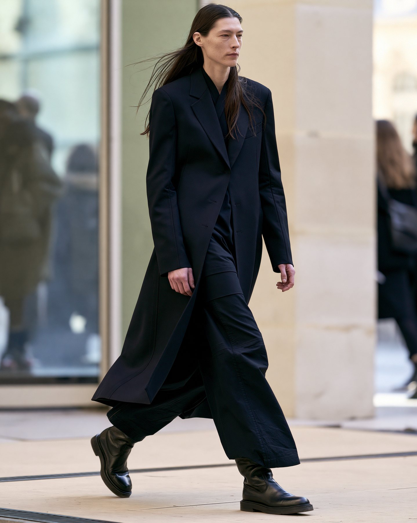 Full-body street-style fashion look in dark tailoring and soft daylight.
