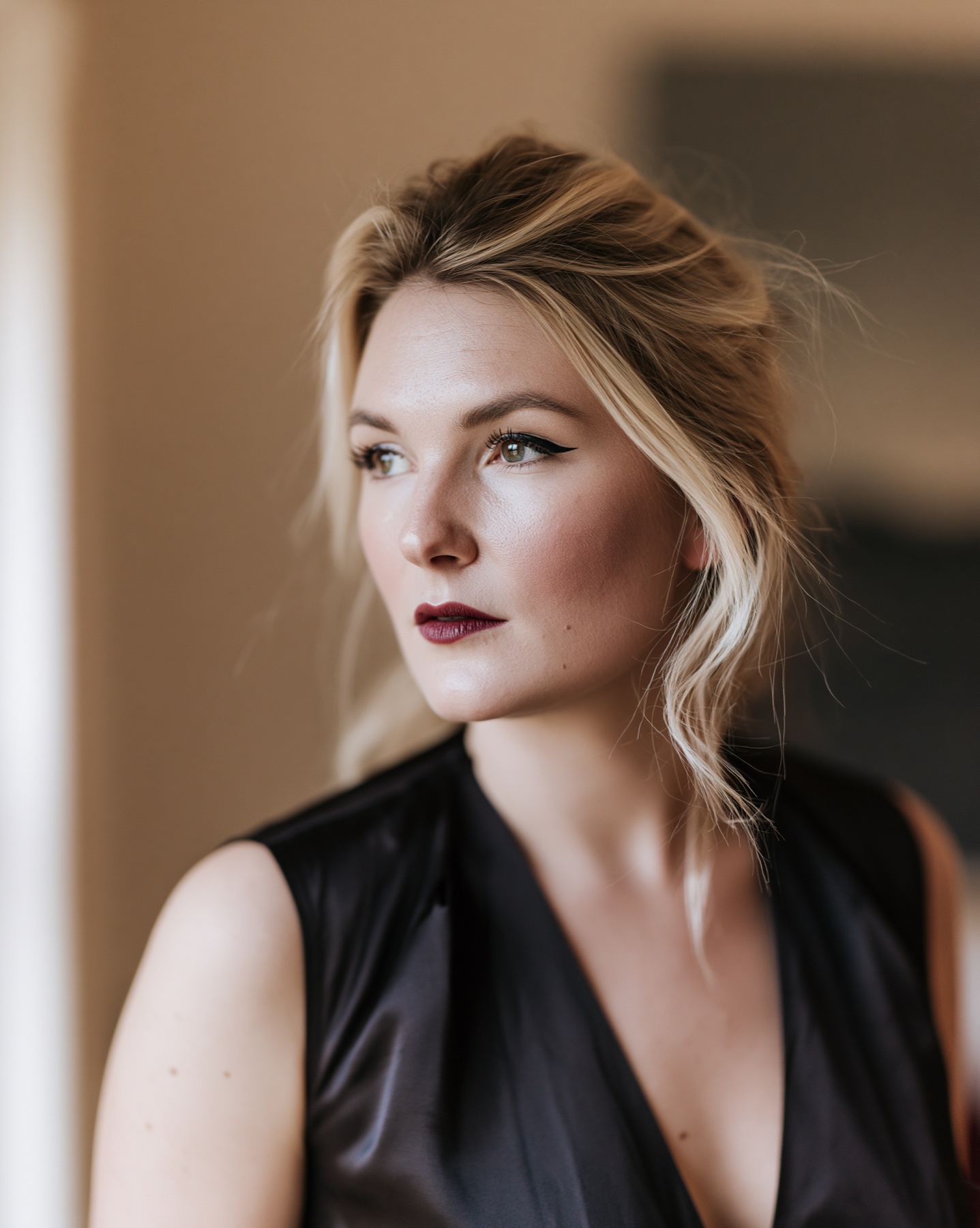 Natural blonde AI character portrait in warm editorial light.